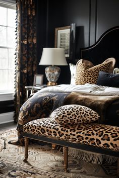 a leopard print bed in a black bedroom