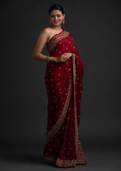 COLOR : Rosewood Red & Beige Gold FABRIC : Saree - Art Silk, Blouse - Gota WORK : Dori Work, Stones, Sequins & Lace BorderOCCASION : Wedding, Engagement, Party Wear, Festival, Sangeet NOTE : The outfit includes blouse and saree only. Petticoat is not included. READY-TO-WEAR : No STITCHING : Available as semi-stitched fabric, can be stitched using standard size option (+$20). Note: There might be a slight color variation due to lighting and flash used during photoshoot. The bright shade seen is t Best Lehenga Designs, Red Saree Wedding, Marriage Function, Red Sari, Maroon Saree, Designer Sarees Wedding, Simple Saree Designs, Wedding Sari, Raw Silk Saree