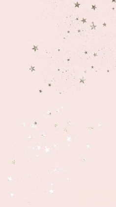 a pink background with silver stars in the sky