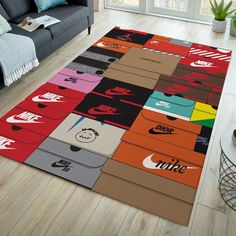 a living room with a couch and rug that has nike logos all over the floor