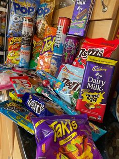 an open gummy machine filled with lots of different flavored candy and candies