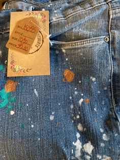 These Vintage jeans are distressed perfectly.  You gotta love the boyfriend fit and the rough hem; with just a little bit of stretch.  The jeans have been upcycled with colorful splatters making them unique. Roll 'em up with your sneakers, or throw 'em on with your flipf flops,  these jeans the perfect solution for summer. #distressed #splatterjeans #perfectjeans #upcycleclothing #boyfriendjeans #cropjeans #splatter #vintagejeans DETAILS Size: 10 Color: faded, distressed denim; rough hem Details Spring Straight Leg Bottoms With Paint Splatter, Trendy Denim Bottoms With Paint Splatter, Spring Denim Bottoms With Paint Splatter, Straight Leg Cotton Jeans With Paint Splatter, Spring Artsy Denim Jeans, Artsy Spring Denim Jeans, Trendy Paint Splatter Denim Bottoms, Spring Paint Splatter Denim Bottoms, Paint Splatter Straight Leg Denim Jeans