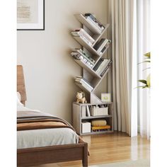 a bed room with a neatly made bed and a book shelf