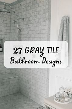 a bathroom with white tile and gray tiling on the shower wall is featured in this article