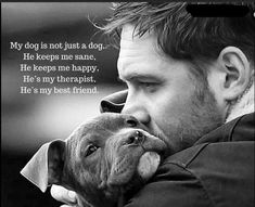 a man is holding a dog and kissing it's face with the caption that says, my dog is not just a dog he keeps me sane he keeps me happy