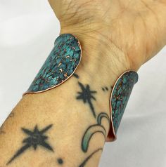 These unique, hand-formed copper and brass cuff bracelets with vibrant patinas create stunning accents to your personal style. Dress up or down- either way you'll be wearing an adornment that will turn heads, start conversations, and delight the eye of the beholder. This is a wide, hammered Copper cuff with a bright blue patina, flanged/textured edges and rounded ends. Please note that patina colors look slightly different depending on the device you view the product on. This is a small cuff- se Artisan Copper Cuff Bracelet Adjustable, Artisan Copper Cuff Bracelet With Adjustable Fit, Adjustable Copper Artisan Cuff Bracelet, Artisan Adjustable Copper Cuff Bracelet, Adjustable Artisan Copper Cuff Bracelet, Artisan Turquoise Copper Bracelet, Unique Hand Wrapped Cuff Bracelet, Artisan Hand Forged Adjustable Cuff Bracelet, Copper Cuff Bracelet Wearable Art Gift