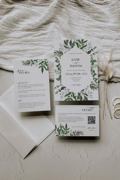 the wedding stationery was designed with greenery