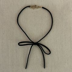 Nwot Black Suede Bow Choker Necklace Adjustable Gold Clasp/Chain Goes Up To 14" No Returns Or Exchanges Fall Trend - Must Have Very J. Crew - Anthropologie - Boden - Banana Republic - Vineyard Vines - Nordstrom - Gucci - Theory - Lacoste - Ann Taylor - Zara - Tuckernuck - Veronica Beard - Staud Black Bow Choker, Black Adjustable Choker For Party, Black Necklace With Ribbon For Gift, Adjustable Black Necklace With Black Ribbon, Elegant Black Choker With Adjustable Length, Elegant Black Necklace With Adjustable Cord, Adjustable Black Ribbon Choker Jewelry, Adjustable Black Ribbon Choker, Black Ribbon Choker Necklace