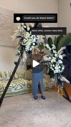 a woman standing in front of a black and white photo with flowers on her head