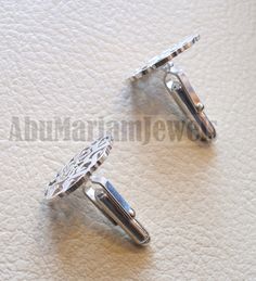 cufflinks 2 or 1 name calligraphy arabic customized any name made to order sterling silver 925 heavy men jewelry the names on the sample are Michael Gaberman مايكل جابرمان please allow 10 to 15 days to complete , this is made to order item . write your name or the name you want in english or arabic , with the order please . we use 1.2 mm minimum thickness silver plate for the face of the cufflinks so it will be strong and heavy Any change on design can be discussed and applied . the name circle Designer Silver Cufflinks For Wedding, Designer Silver Wedding Cufflinks, Elegant Engraved White Gold Cufflinks, Silver Luxury Personalized Cufflinks, Designer Silver Cufflinks Gift, Personalized Silver Luxury Cufflinks, Luxury Personalized Silver Cufflinks, Personalized Luxury Silver Cufflinks, Name Circle