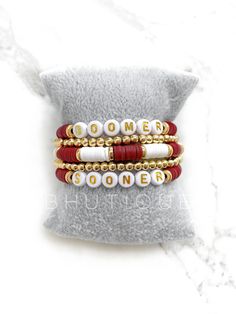 Boomer Sooner Bracelet with Two 14k Gold Plated Bead Bracelet and 18K Gold Plated Spacer Disc Beads Set of 5 Bracelets ★ Please note that colors may vary slightly depending on your monitor settings ★ ★ All sales are final. No refunds or returns. All items are handmade to order, just for you! ★ Please double-check all order details and your shipping address prior to submitting the order. Your order will be shipped to the address provided. If you need to change the shipping address, place a new order and notify us immediately. We are not responsible for any orders that are shipped to the incorrect address. We truly appreciate your business - thank you for shopping with us! Gold Heishi Beads Bracelets As Gift, Gold Heishi Beads Bracelet Gift, Gold Heishi Beads Name Bracelet As Gift, Personalized Gold Heishi Beads Bracelets, Boomer Sooner, College Student Gifts, University Of Oklahoma, College Gifts, Day Care