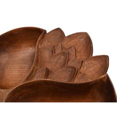 three wooden bowls are stacked on top of each other in the shape of an abstract flower