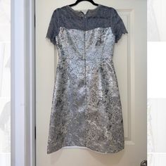 T Tahari Knee Length Silver/Grey Cocktail Dress Zipper Closure Never Worn But Tore Off The Tags Gray Short Sleeve Dress For Evening, Elegant Metallic Short Sleeve Dresses, Elegant Short Sleeve Metallic Dress, Elegant Silver Festive Dress, Silver Fitted A-line Dress, Silver A-line Fitted Dress, Gray Fitted Holiday Dresses, Fitted Knee-length Silver Dress, Fitted Silver Knee-length Dress