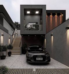 a black car parked in front of a house with stairs and lights on the side