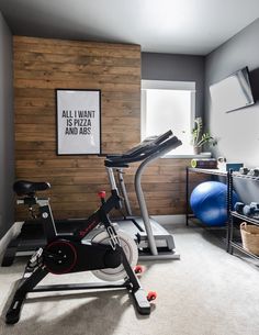 a home gym with an exercise bike and cardio machine