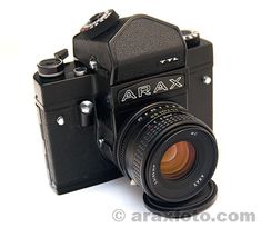 an old camera with its lens attached to it