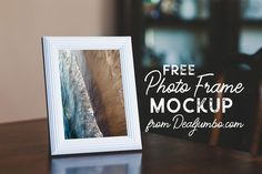 a photo frame sitting on top of a wooden table next to a wall with the words free photos frame mockup