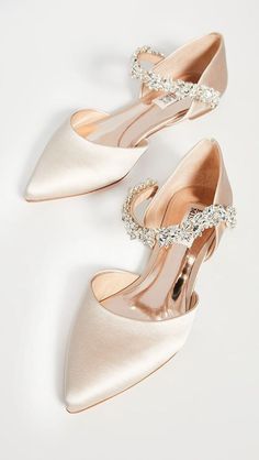 two pairs of women's wedding shoes on white background