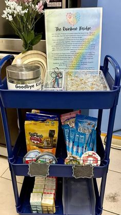 a blue cart filled with food on top of a kitchen counter