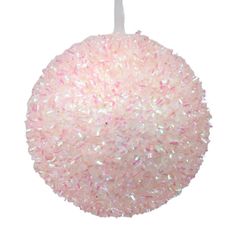 a pink ornament hanging from a white string