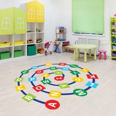 a child's playroom with toys, bookshelves and colorful rugs