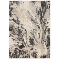 a black and white rug with an abstract design