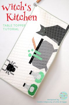 the witch's kitchen table topper is made from an old quilt pattern, and has