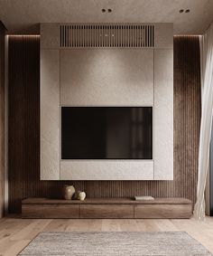 a living room with a flat screen tv mounted on the wall and wooden flooring