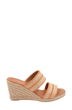 Woven raffia creates a boho aesthetic on an espadrille-inspired slide sandal lofted by a subtle platform and wedge heel. 3" heel; 1/2" platform Cushioned footbed Textile upper/leather lining and sole Made in Spain Orange Platform Wedge Sandals For Summer, Orange Wedge Sandals For Summer, Orange Sandals With Woven Sole For The Beach, Orange Beach Sandals With Woven Sole, Orange Open Toe Wedge Sandals For Spring, Spring Orange Open Toe Wedge Sandals, Orange Slip-on Wedge Sandals For Summer, Orange Synthetic Wedge Sandals For Spring, Orange Slip-on Wedge Sandals For Beach