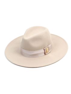 Editor's NotesThis classic fedora is made from soft wool-felt and trimmed with a traditional grosgrain ribbon with a metal logo. It has a Velcro fastening inside so easy to adjust fit.- Grosgrain ribbon and metal logo trim at the side- Adjustable inside Velcro fastening- Unisex wearMeasurements (in.) One size- Height: 5.1 in. - Brim Length: 3.5 in.- Circumference: 23.2 in.  Composition & Care- 100% Wool- Refer to the care labelDesigner- by Universal chemistry Elegant Beige Fedora With Flat Crown, Classic Beige Fedora Felt Hat, Elegant Beige Fur Felt Fedora, Classic Fur Felt Hat For Spring, Luxury Brimmed Fedora For Fall, Elegant Beige Winter Fedora, Luxury Wool Fedora With Flat Brim, Classic Wool Fedora For Spring, Classic Beige Wool Hat Band