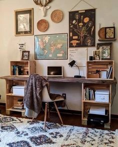 a bedroom with a bed, desk and pictures on the wall