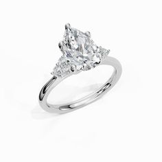 an engagement ring with two pear shaped diamonds