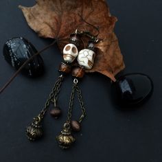 Long, dangly earrings with white skull beads and long chain.  Everything apart from the earring wires and skulls in this piece is upcycled from broken and unwanted jewellery.  The wires are suitable for sensitive piercings, but if you would prefer silver wires please leave a message in the Notes section when purchasing or send me a message. White Bohemian Skull Jewelry, Bohemian Handmade Skull Earrings, Knuckle Duster, Skull Beads, Earring Wires, Tourmaline Pendant, Spike Earrings, Beaded Skull, Skull Earrings