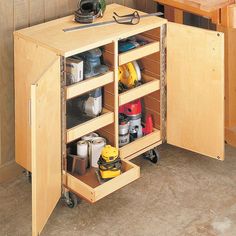 a workbench with lots of tools in it and some drawers on the side