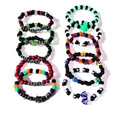 Spooky Kandi Beaded Bracelets These Kandi beaded bracelets are spooky enough for any rave, EDM Festival, Halloween Party, or if you're into a spooky aesthetic...these bracelets were made for you !! Each order will receive 10 randomly selected bracelets.  Styles of Bracelets in this package  - Worded with Charm(s) - Worded - Charm(s) - Beaded Only We make our bracelets with elastic string  They'll come in a variety of adult sizes (Please send us a message if you want these bracelets made a certain size. We'll be happy to make them for you) Here is a list of spooky charms that may be used on your Kandi bracelets  - Evil Eyes - Witches - Stars - Skulls - Ghosts - Bats - Black Cats - Pumpkins These Kandi bracelets are randomly selected but if you'd like a custom order of 10 Kandi Beaded Bracel Emo Goth Aesthetic, Pony Bead Jewelry, Scary Dark, Kandi Necklace, Spooky Aesthetic, Rave Edm, Rave Accessories, Kandi Bracelets, Edm Festival