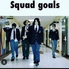 three men in suits walking down a hall way with the caption squad goals above them