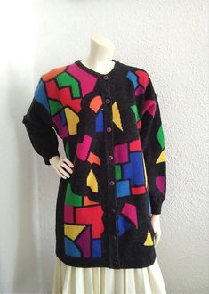 80s BETTY BARCLAY pop-art cardigan colorful long cardigan spring knitted jacket multicolor cardigan lambswool cardigan patchwork pattern top, 82% lambswool, 10% poliamid, 8% angora.  GOOD VINTAGE CONDITION (have some pile because is wool fabric), BUT THE SWEATER IS NOT DRY CLEAN  measurements lying flat : shoulders :64 cm (25 inches)  bust :58 cm (23 inches)  total length :80 cm (31,5 inches)  sleeve length :52 cm (20.5 inches) Vintage Multicolor Cardigan For Fall, Retro Winter Color Block Cardigan, Colorful Color Block Winter Cardigan, Colorful Long Sleeve Cardigan With Color Block, Colorful Long Sleeve Color Block Cardigan, Multicolor Patchwork Long Sleeve Cardigan, Multicolor Long Sleeve Cardigan With Color Matching, Retro Patchwork Cardigan For Fall, Vintage Multicolor Cardigan For Winter