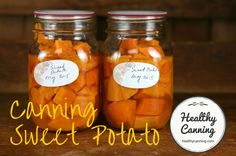 two jars filled with sliced carrots sitting on top of a wooden table next to each other