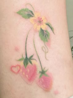 a tattoo with flowers and hearts on it