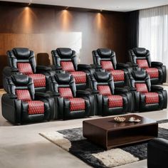 a room filled with lots of black chairs and red pillows on top of each chair