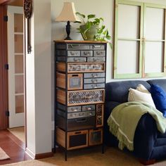 a living room filled with furniture and a lamp