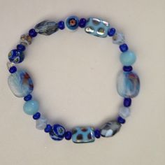 Glass beaded bracelet Very pretty glass bead bracelet in blues.  New, stretch Jewelry Bracelets Glass Beaded Bracelet, Glass Bead Bracelet, Glass Beaded Bracelets, Bead Bracelet, Glass Bead, Womens Jewelry Bracelets, Beaded Bracelet, Turquoise Bracelet, Glass Beads