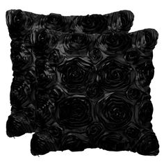 two black pillows with roses on them