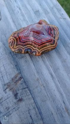 a piece of wood sitting on top of a wooden table