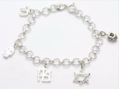 Sterling Silver Jewish Symbol Charm Bracelet Judaica from JewelryJudaica Love In Hebrew, Jewish Symbol, Jewish Symbols, Jewish Culture, Hamsa Pendant, Jewish Jewelry, Star Of David Pendant, Dope Jewelry, Ring Ideas