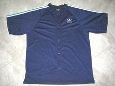 You are viewing a lot of 1: Adidas VINTAGE"HIP HOP/RUN DMC" Style SHORT Sleeve, Snap button front athletic/sports/track/basketball warm up jacket. Embroidered Adidas logo. Colors: BLue with green/white stripes. Size (When Flat):  According to the label: EXTRA LARGE/XL Item Conditions: Item is preowned and used. NO holes, rips, or bad odors. There is slight yellow stain on one of the yellow tri stripes - see photo 11 - probably will wash out in the next wash.  All moving/opening parts are working Casual Adidas Track Jacket For Sports Events, Adidas Casual Moisture-wicking Track Jacket, Navy Adidas Track Jacket For Sports, Adidas Navy Track Jacket For Sports, Navy Adidas Track Jacket For Streetwear, Adidas Navy Track Jacket For Streetwear, Casual Blue Sports Track Jacket, Casual Navy Track Jacket For Sports Events, Adidas Navy Casual Track Jacket