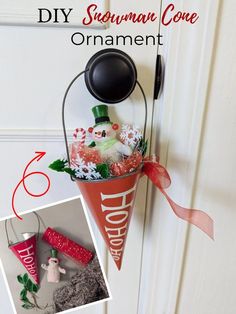 an ornament hanging on the side of a door decorated with snowman decorations