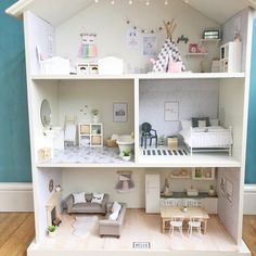 a doll house is shown with furniture and accessories