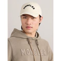 Moncler's baseball cap is embroidered with the arched brand name in thick black lettering across the front. Designed with an internal brow band for comfort, it's made from hard-wearing cotton-gabardine and appliquéd with a signature felt logo above the VECLRO®-fastening back tab. Classic Hats With Logo And Curved Visor, Classic Cotton Baseball Cap With Logo Detail, Streetwear Hat With Logo Detail And Curved Brim, Streetwear Hat With Curved Brim And Logo Detail, Classic Hats With Logo Detail And Curved Visor, Classic Hat With Logo Detail And Curved Brim, Classic Hat With Logo And Curved Brim, Classic Hat With Curved Brim And Logo Detail, Classic Cap With Logo Detail