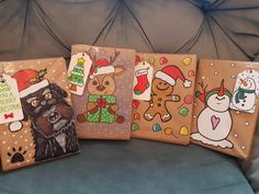 four wrapped presents are decorated with christmas images